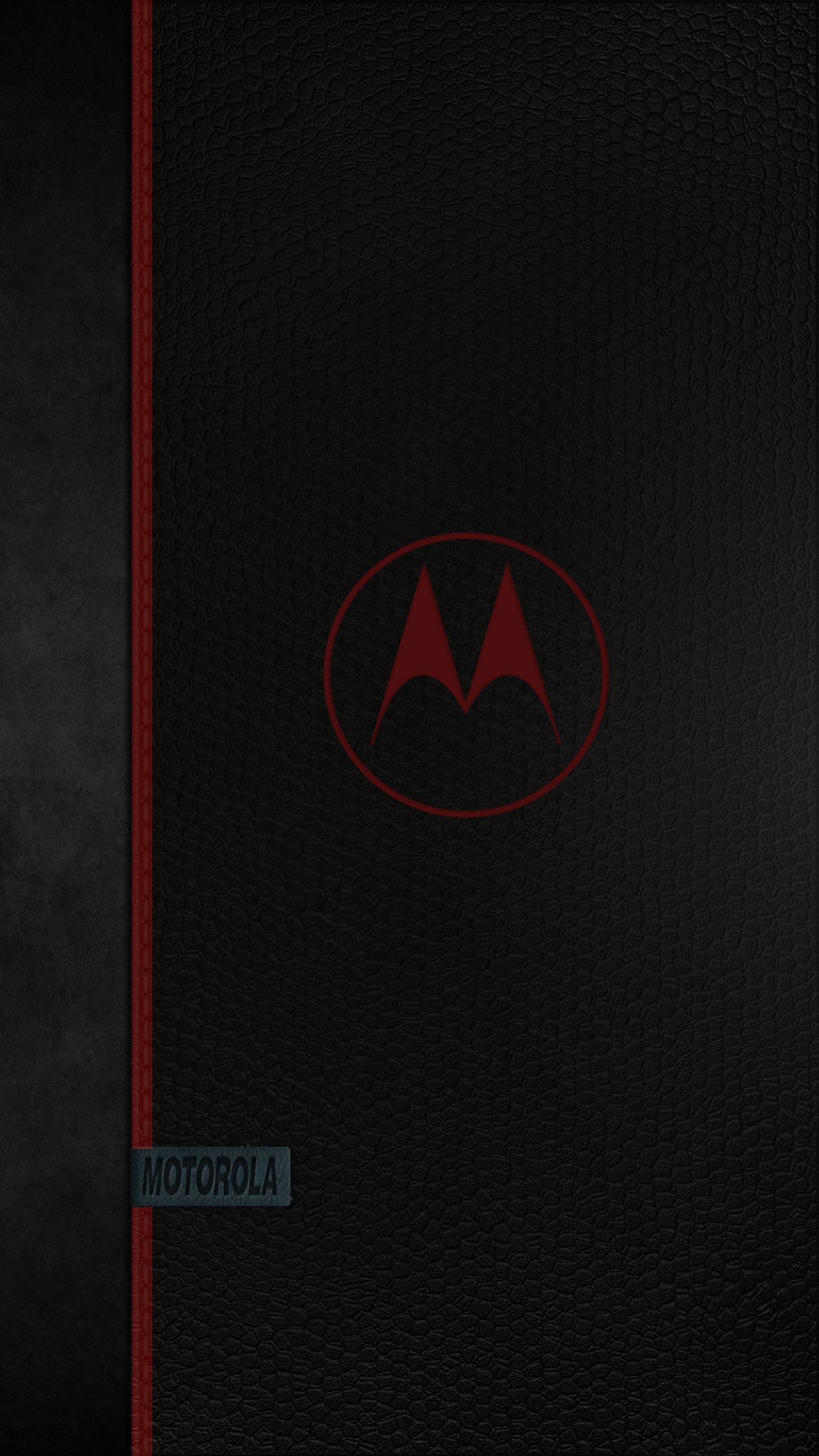 A close up of a motorola logo on a black leather surface (929, black, cool, design, hd)