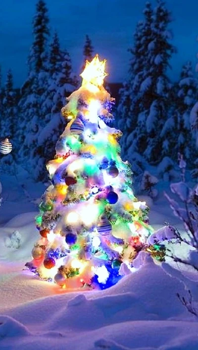 Arbre de Noël enchanteur illuminé dans un pays des merveilles enneigé