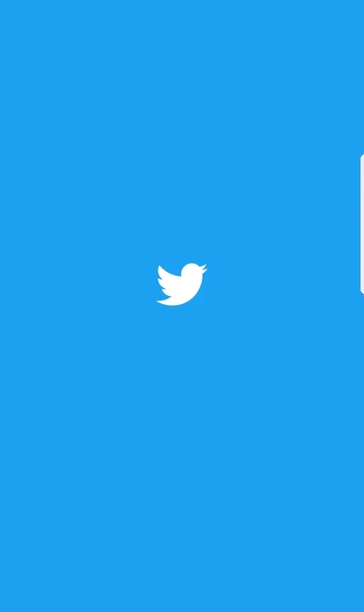 Um fundo azul vibrante com um logotipo de pássaro do Twitter branco, simbolizando conexão e comunicação.