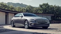 Genesis Electrified G80: Sedán eléctrico de lujo en un paisaje sereno