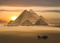 Sunset over the Great Pyramids of Giza and the Sphinx, a timeless landmark of ancient history.