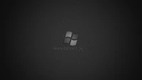 Черно-белый дизайн логотипа Windows 8 на текстурированном темном фоне.