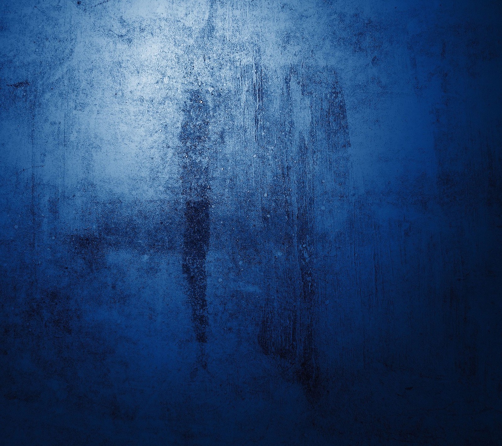 A close up of a person standing in front of a blue wall (abstract, design, texture)