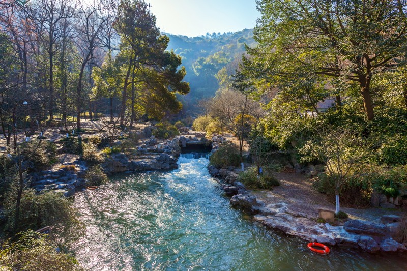 A view of a river with a red raft in the middle (river, nature, tree, water, watercourse)