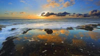 Sunset Reflection on Tranquil Shoreline