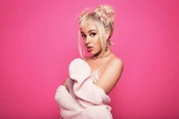 Doja Cat in a pastel pink setting, showcasing her unique style and charisma.