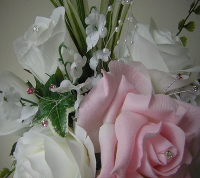 Elegant Arrangement of a Delicate Pink Rose Surrounded by White Flowers and Pearls