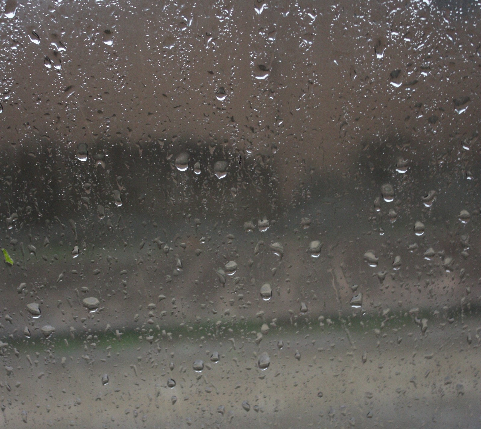 Araffe view of a rain covered window with rain drops (rain)