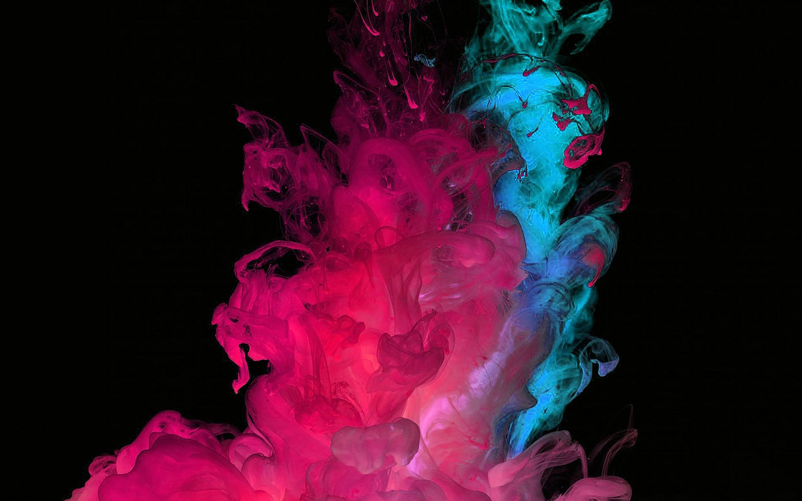 A close up of a pink and blue liquid in water (pink, red, magenta, smoke, water)