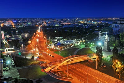 Impresionante vista nocturna de una metrópoli vibrante con un horizonte iluminado y monumentos urbanos