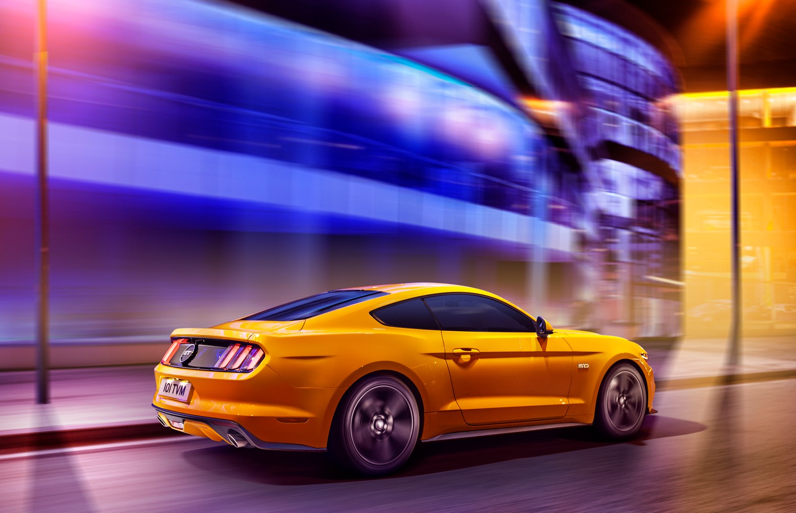 The rear end of a yellow mustang driving down a city street (car, shelby mustang, ford, coup, yellow)