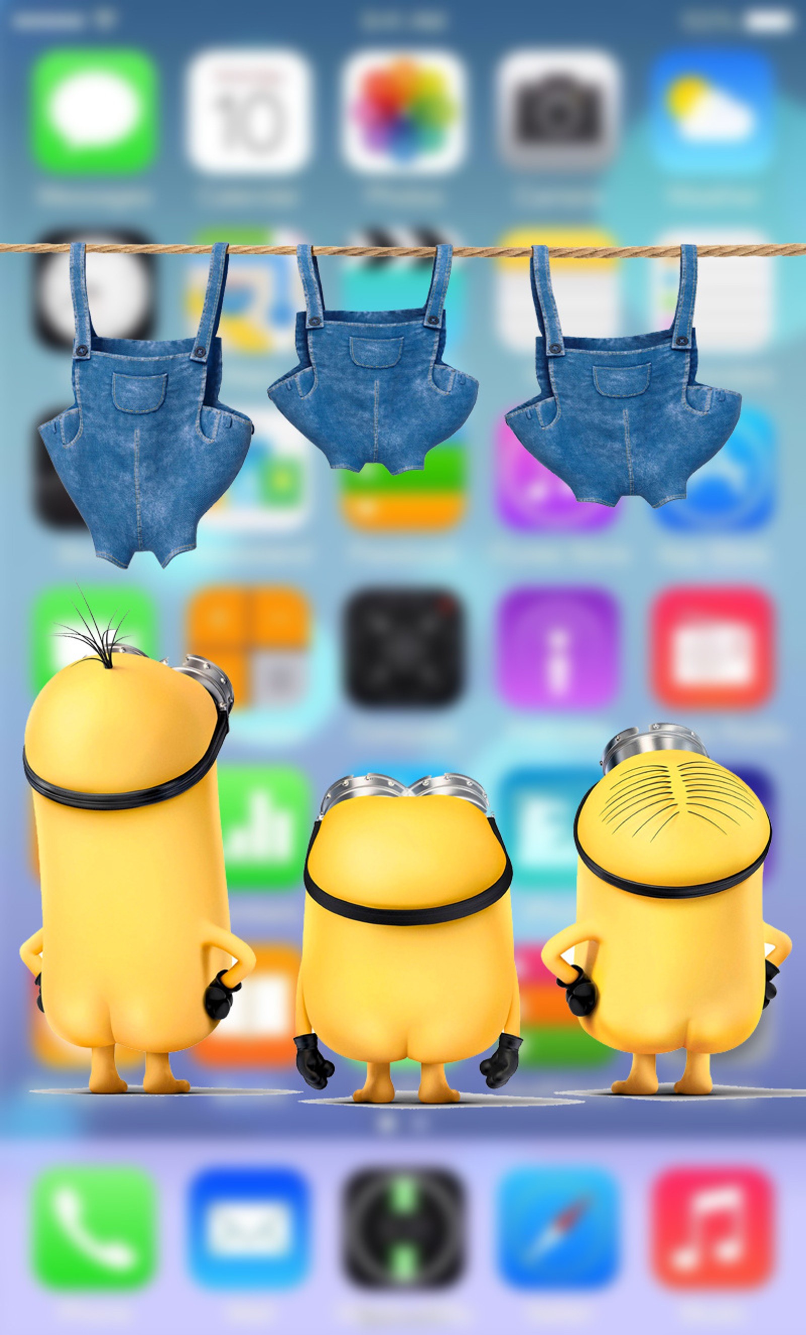 Un primer plano de un grupo de minions colgando de una cuerda de ropa (despreciable, iphone, minion, minions, samsung)