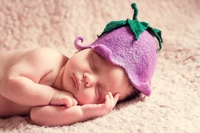 Sleeping Infant in a Tussilago-Inspired Hat