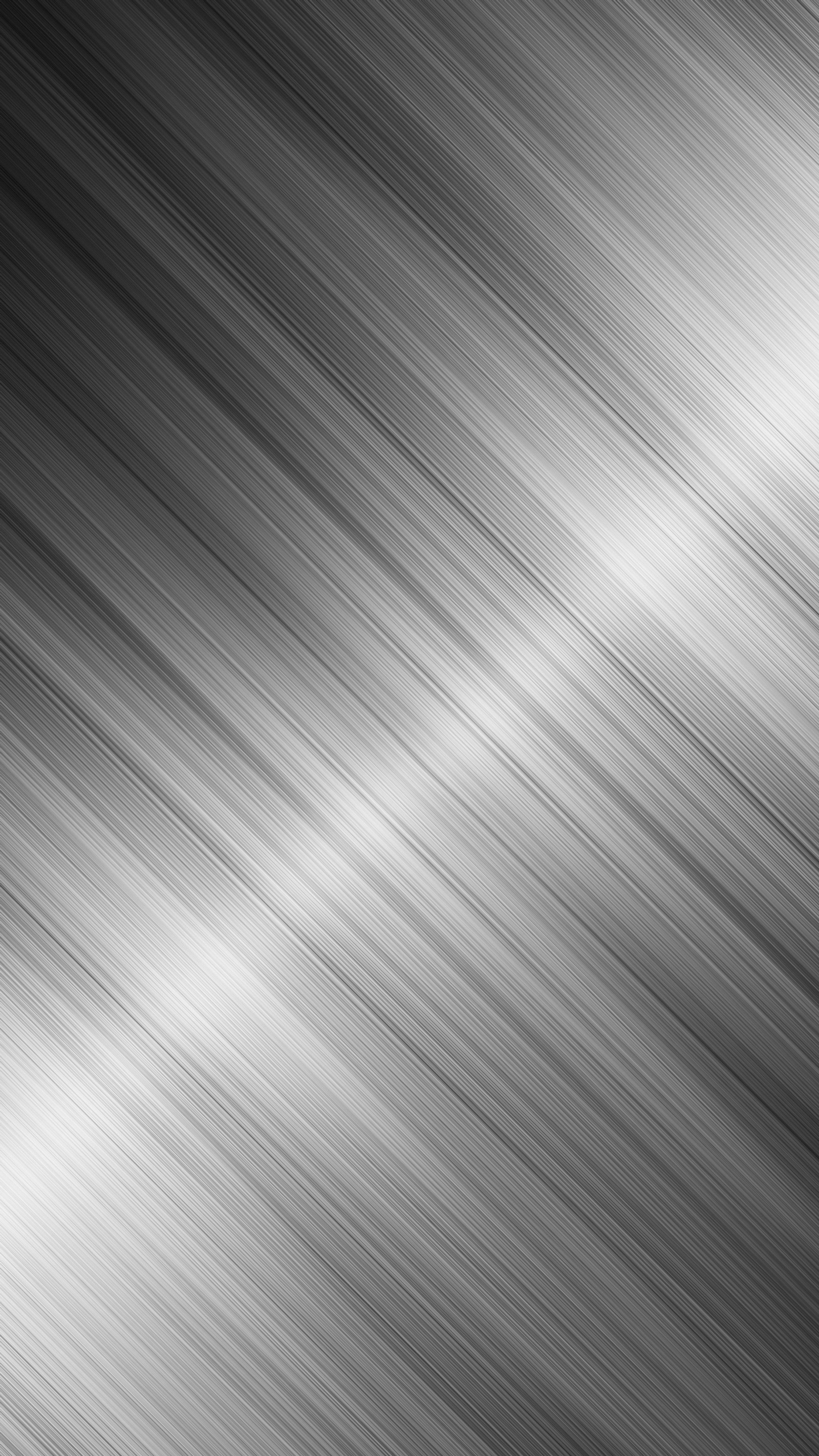 A black and white photo of a metal plate with a blurry background (abstract, background, line, metal)