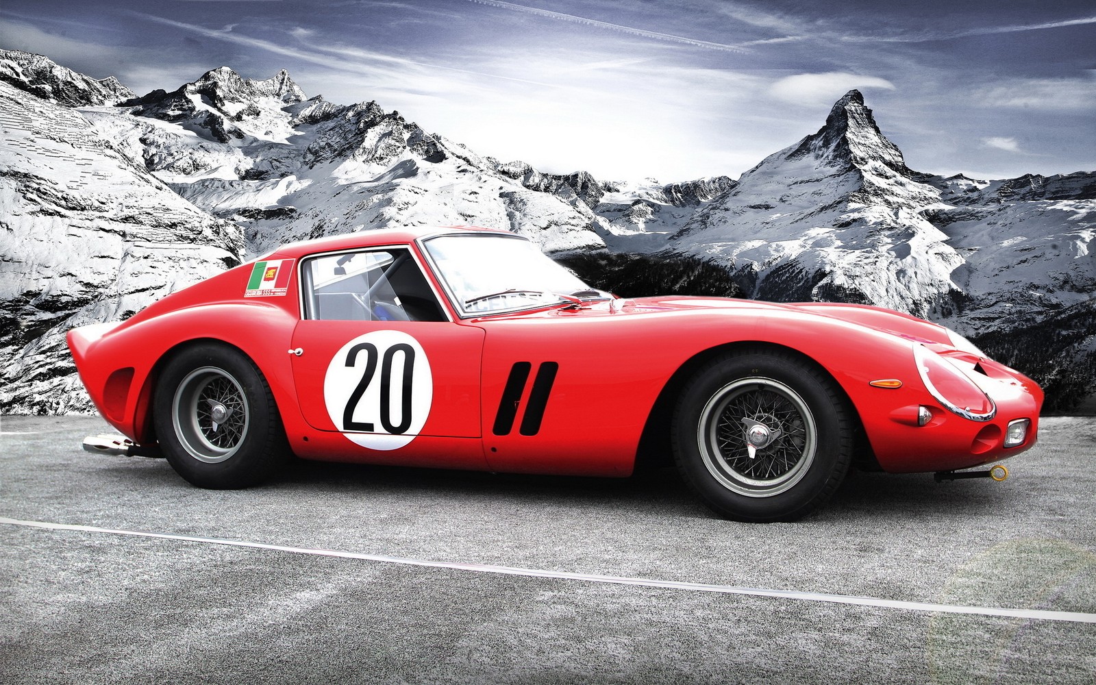 A close up of a red sports car parked in front of a mountain (ferrari 250 gto, ferrari 250 gt lusso, car, ferrari, grand tourer)