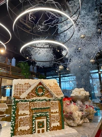 Festive Winter Wonderland with Gingerbread House and Modern Light Fixtures