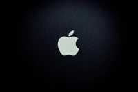 Logo Apple monochrome sur un fond sombre