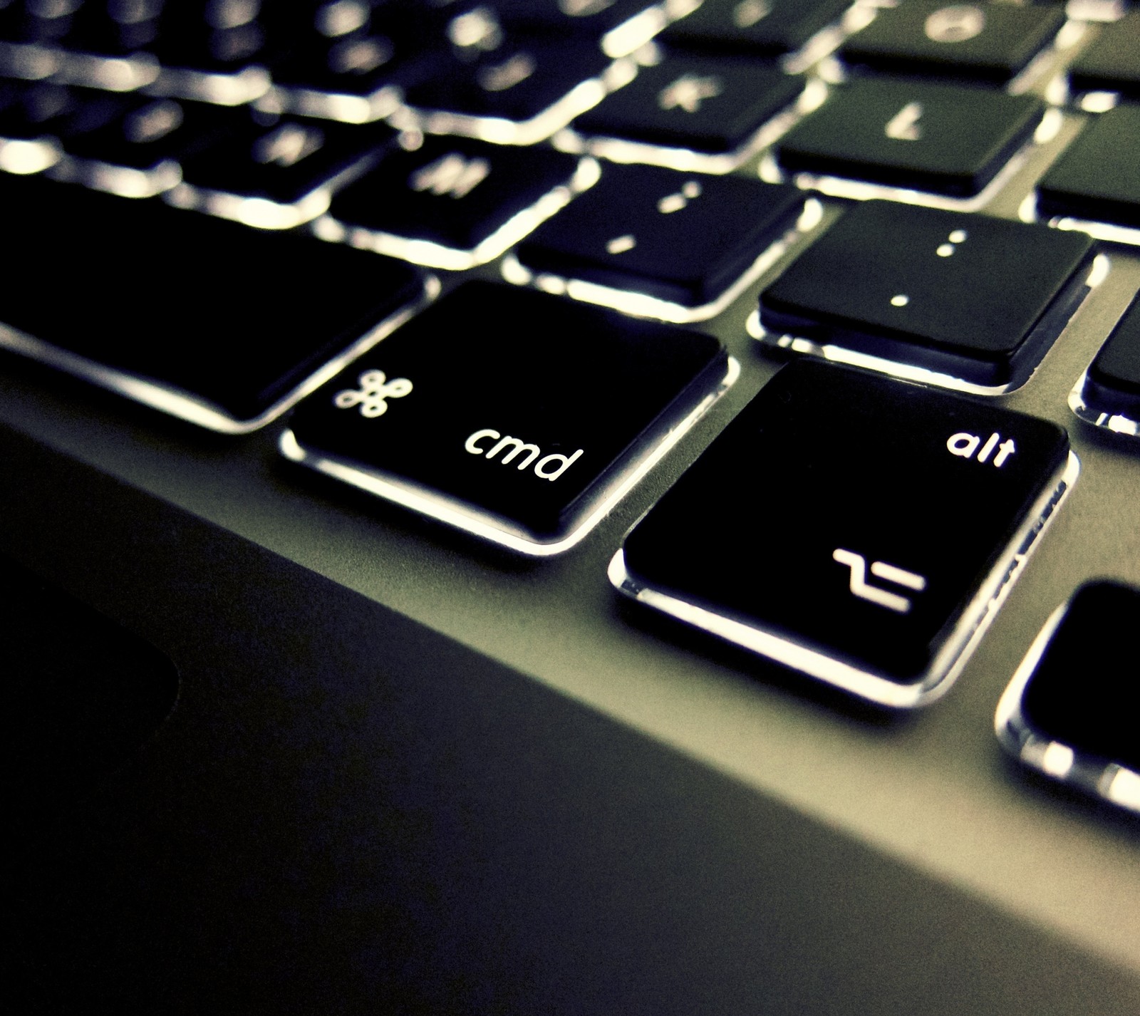 There is a close up of a keyboard with a black key (gadget, keyboard, light, technology)