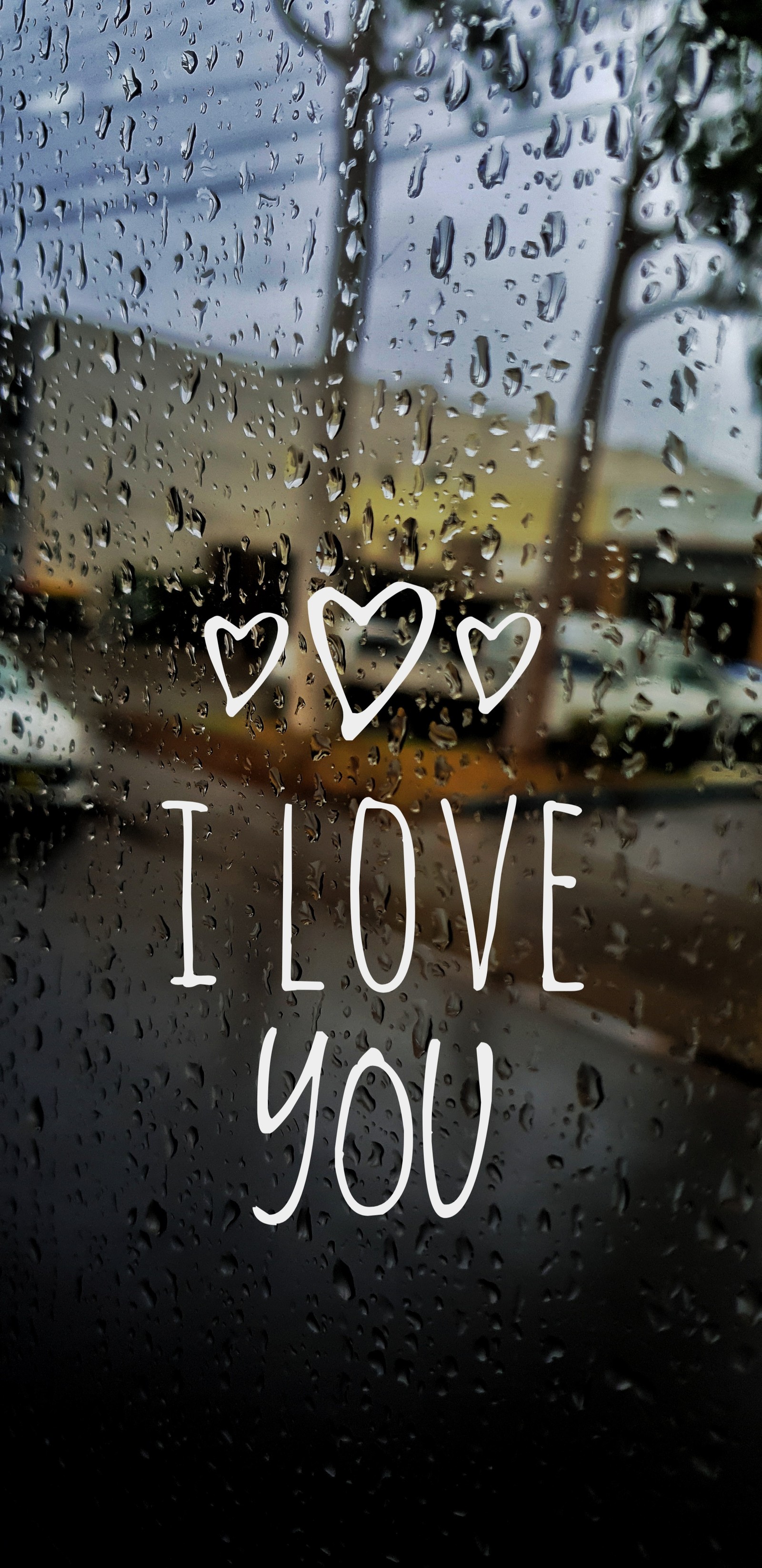 There is a picture of a window with a message on it (weather rain, windows, rain, love)