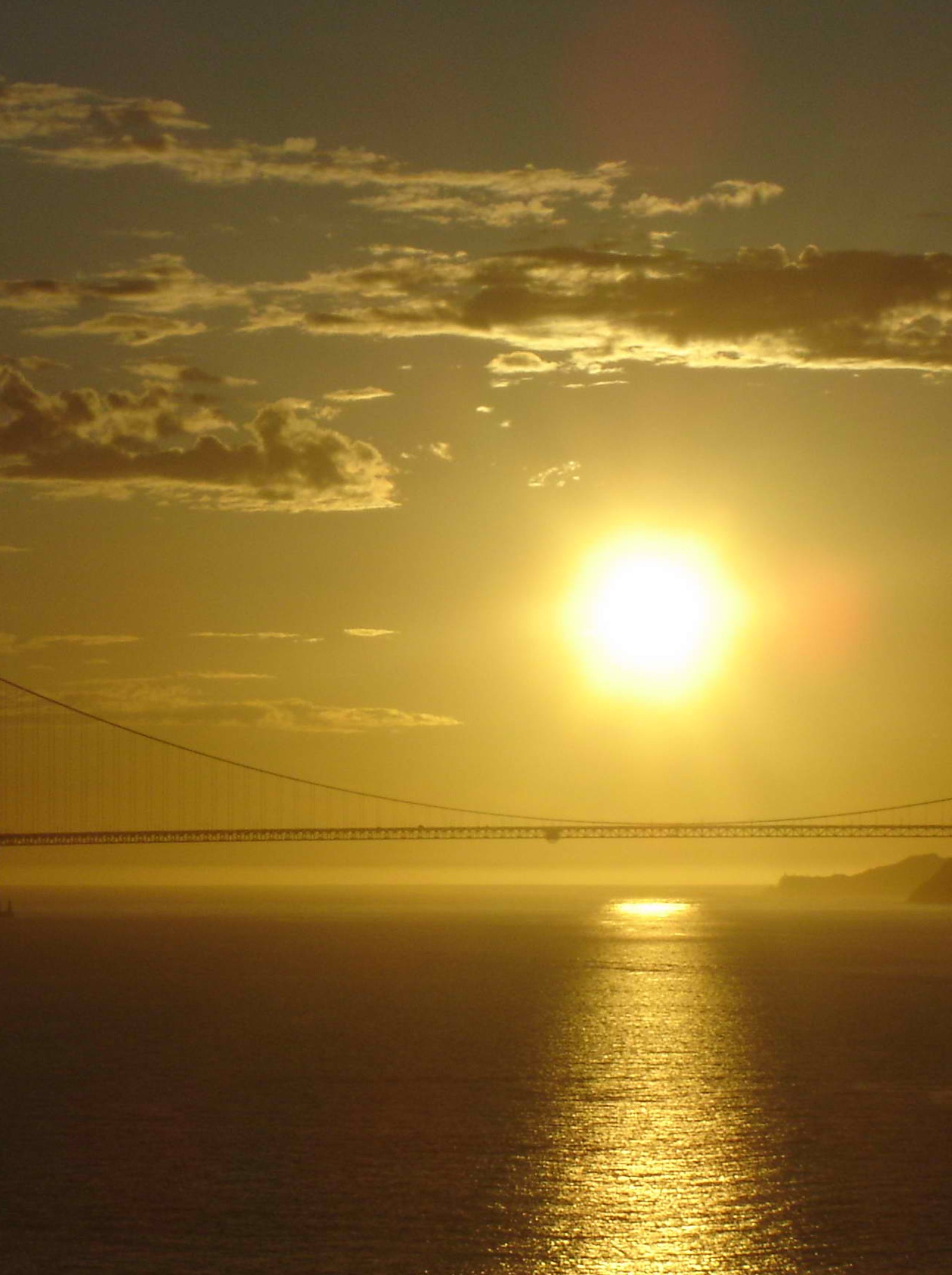 Arafed view of a bridge and a body of water at sunset (golden sunset, nature)