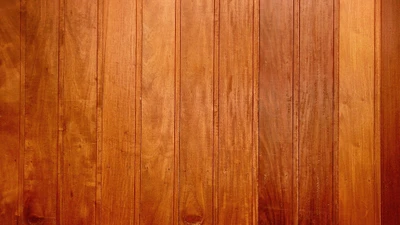 Richly stained hardwood flooring with vertical planks.