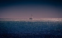 Solitary Sailboat on a Sparkling Horizon