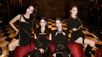 T-ara: Grupo de K-Pop impressionante em traje preto elegante