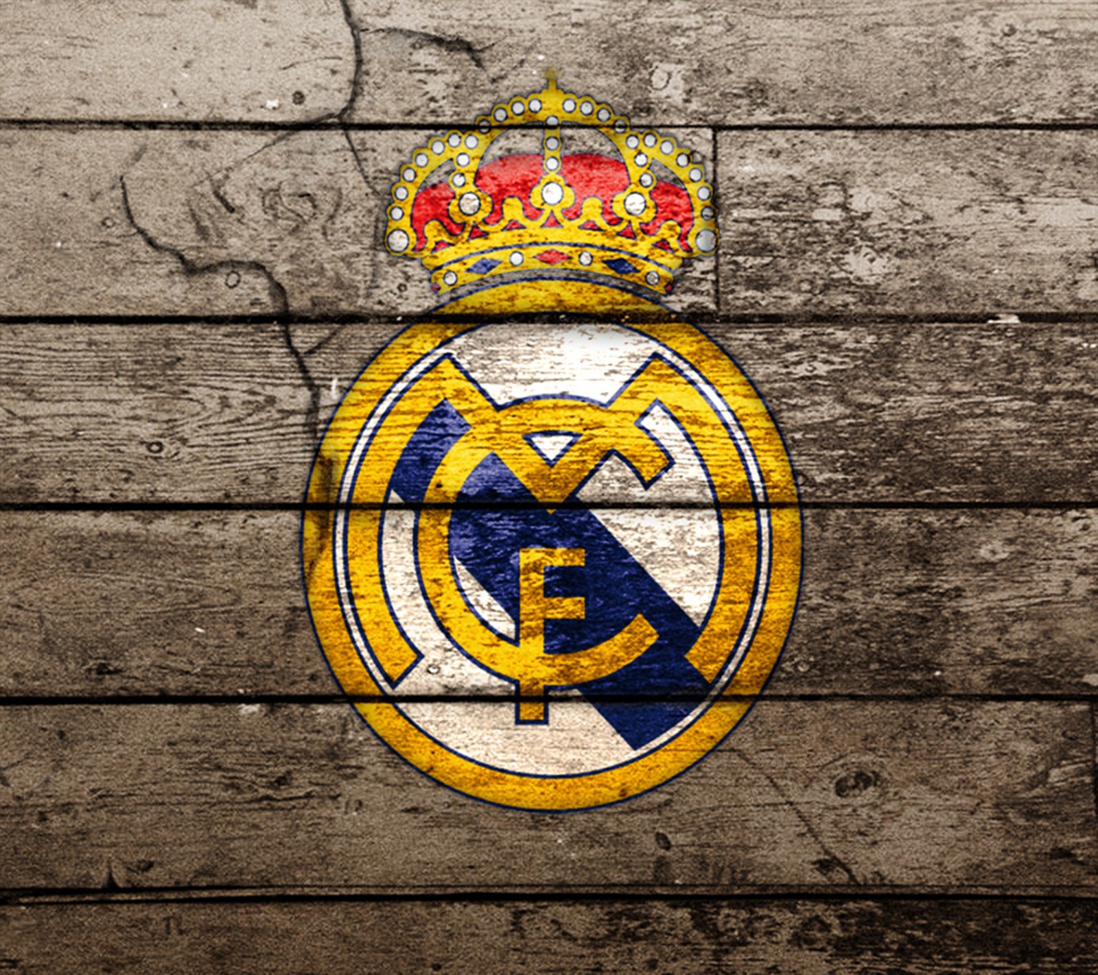 Un gros plan d'un mur en bois avec le blason du real madrid (football, real madrid)