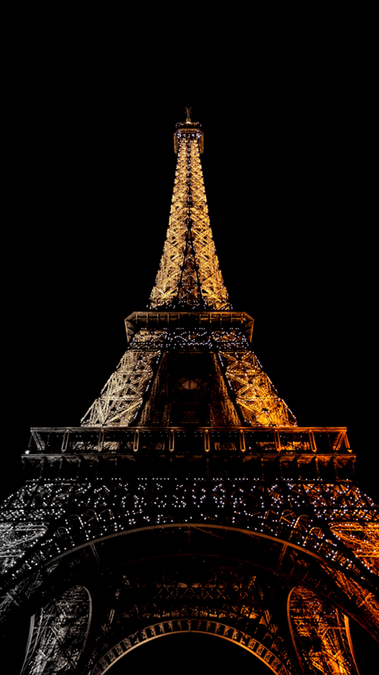 Arafed view of the eiffel tower at night with the lights on (eiffel tower, golden, lights, night, paris)