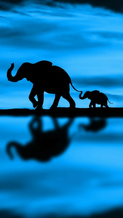 Silhouetted Elephants Against a Blue Sky