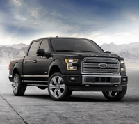 Camión Ford F-150 negro contra un paisaje americano escénico