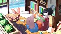 Chill Vibes: A Girl Enjoying a Book in a Cozy Corner with Her Pet