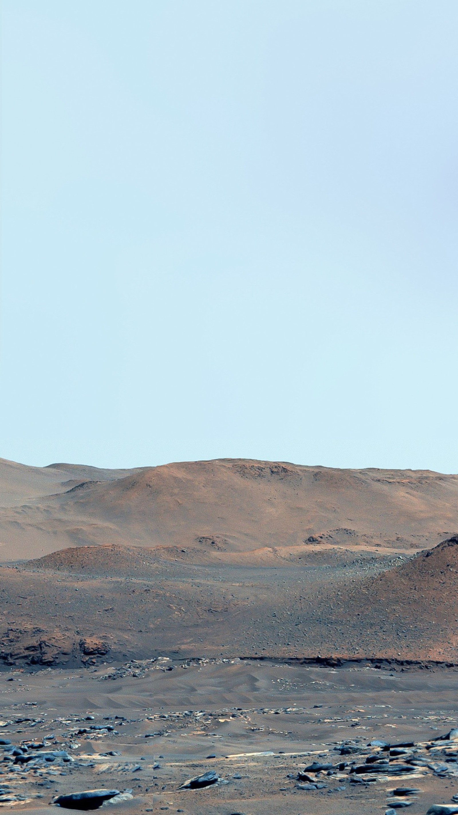 There is a lone airplane flying over a barren area (mars, earth, macaron, nasa, water resources)