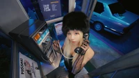 Chaeyoung of TWICE in a vintage phone booth, showcasing a unique blend of modern style and nostalgia.