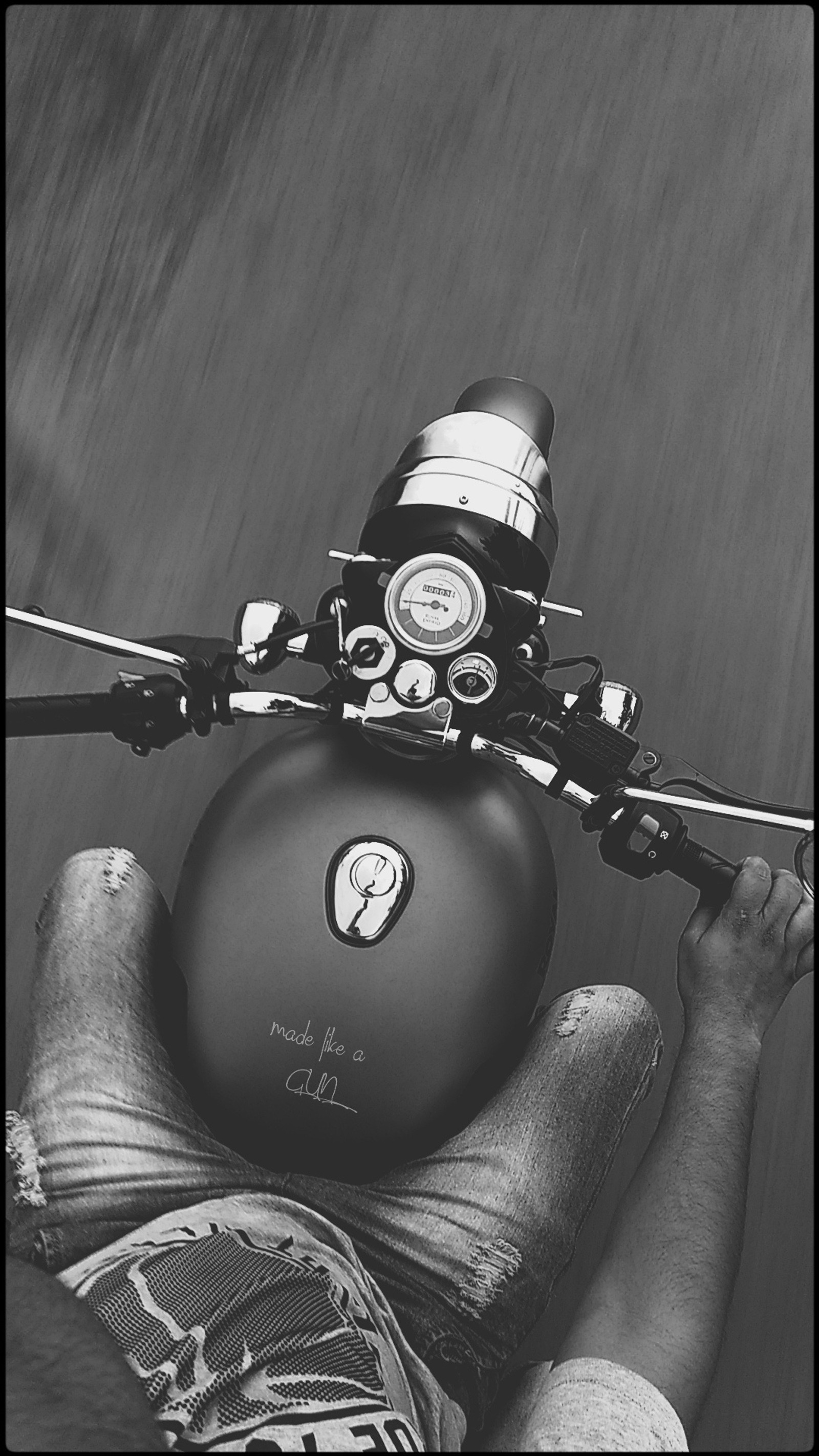 There is a man riding a motorcycle with a helmet on his head (bullet, bullet 350 classic, royal enfield, classic 350, gun metal grey)