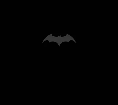 Emblema icónico de Batman sobre un fondo oscuro