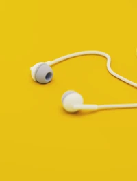 Fones de ouvido minimalistas em fundo amarelo vibrante