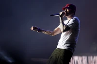 Eminem delivering a powerful performance on stage, showcasing his artistry and connection with the audience.