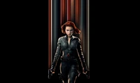 Scarlett Johansson as Black Widow: Dynamic Action Pose Against a Dark Background