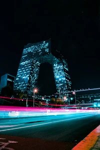 Illuminated Urban Landmark at Night: The CCTV Headquarters in Beijing