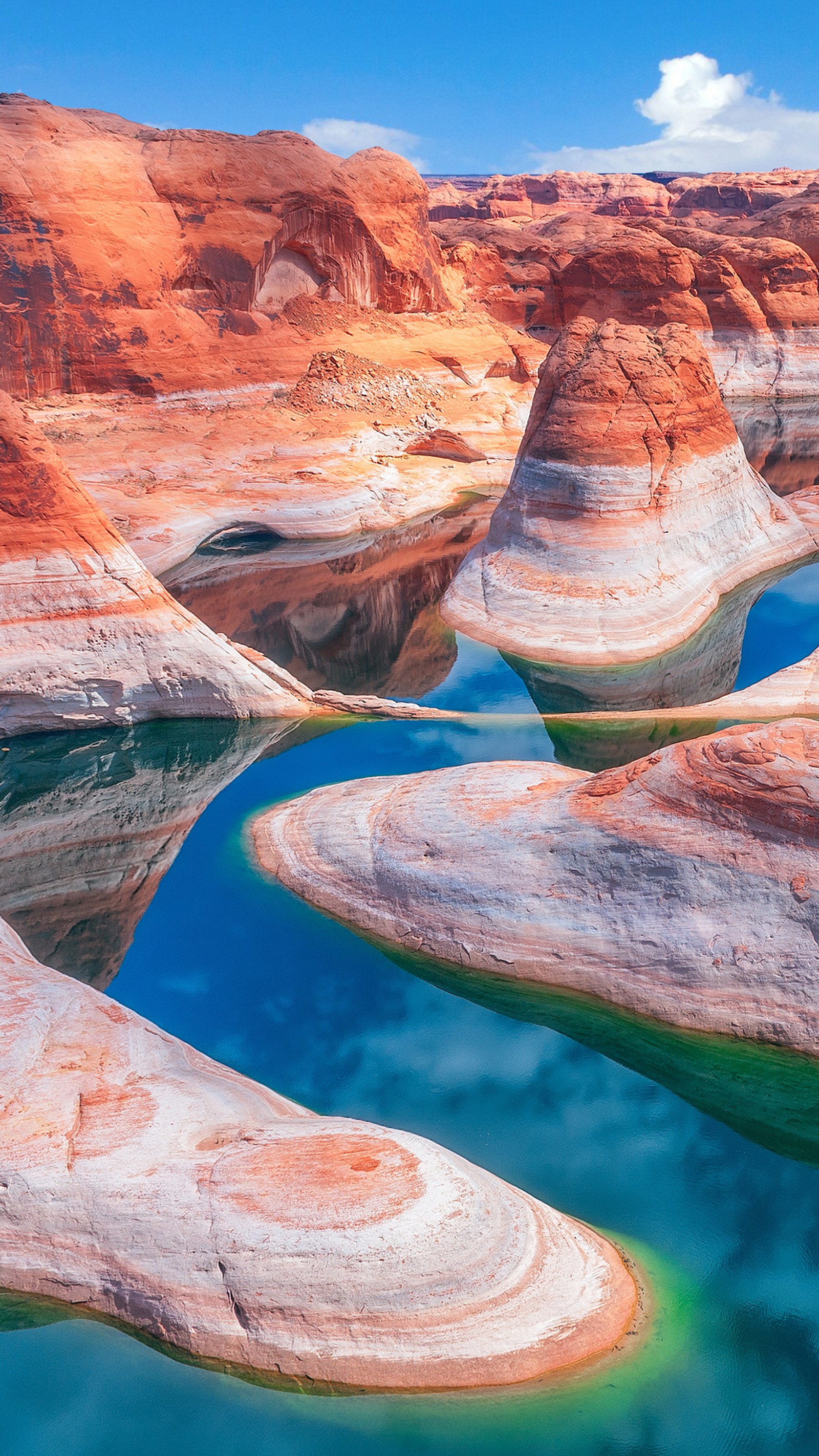 Arafed canyons with a body of water in the middle (beautuful, nature, stones)