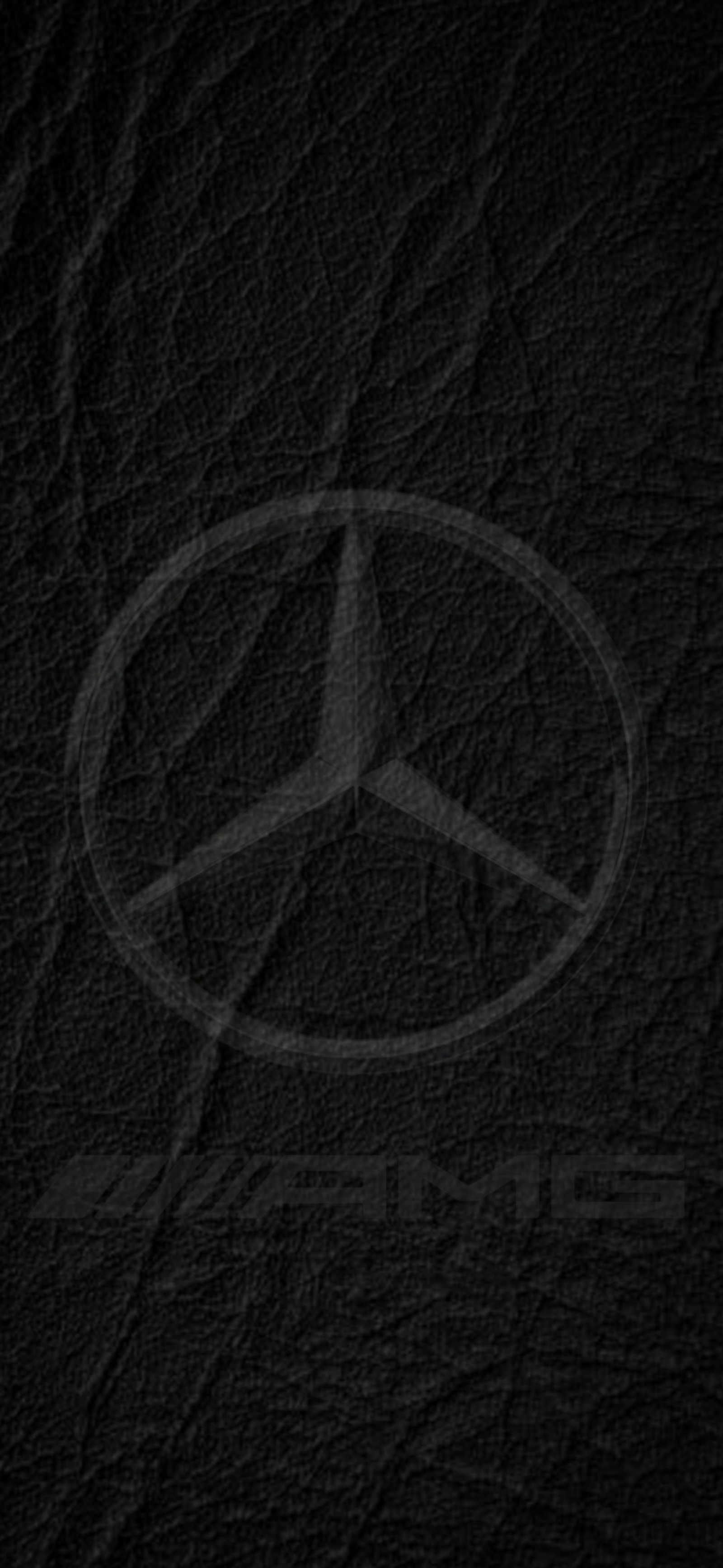 Logo de mercedes sobre un fondo de cuero negro (amg, benz, negro, logotipo, mercedes)