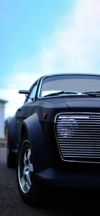 Sleek Black Sports Car with Striking Grille and Modern Lighting