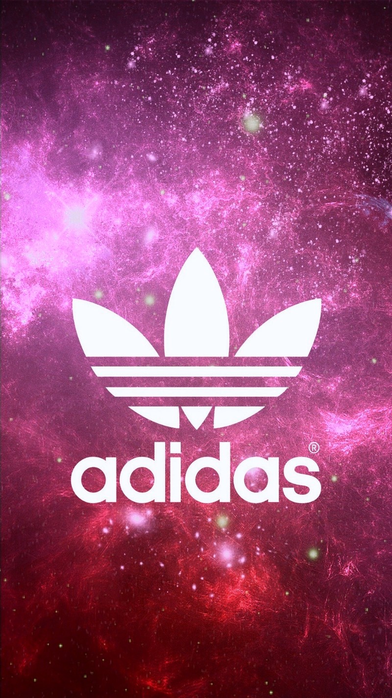 Близкий план красно-белых обоев с белым логотипом adidas (пинкхейз)