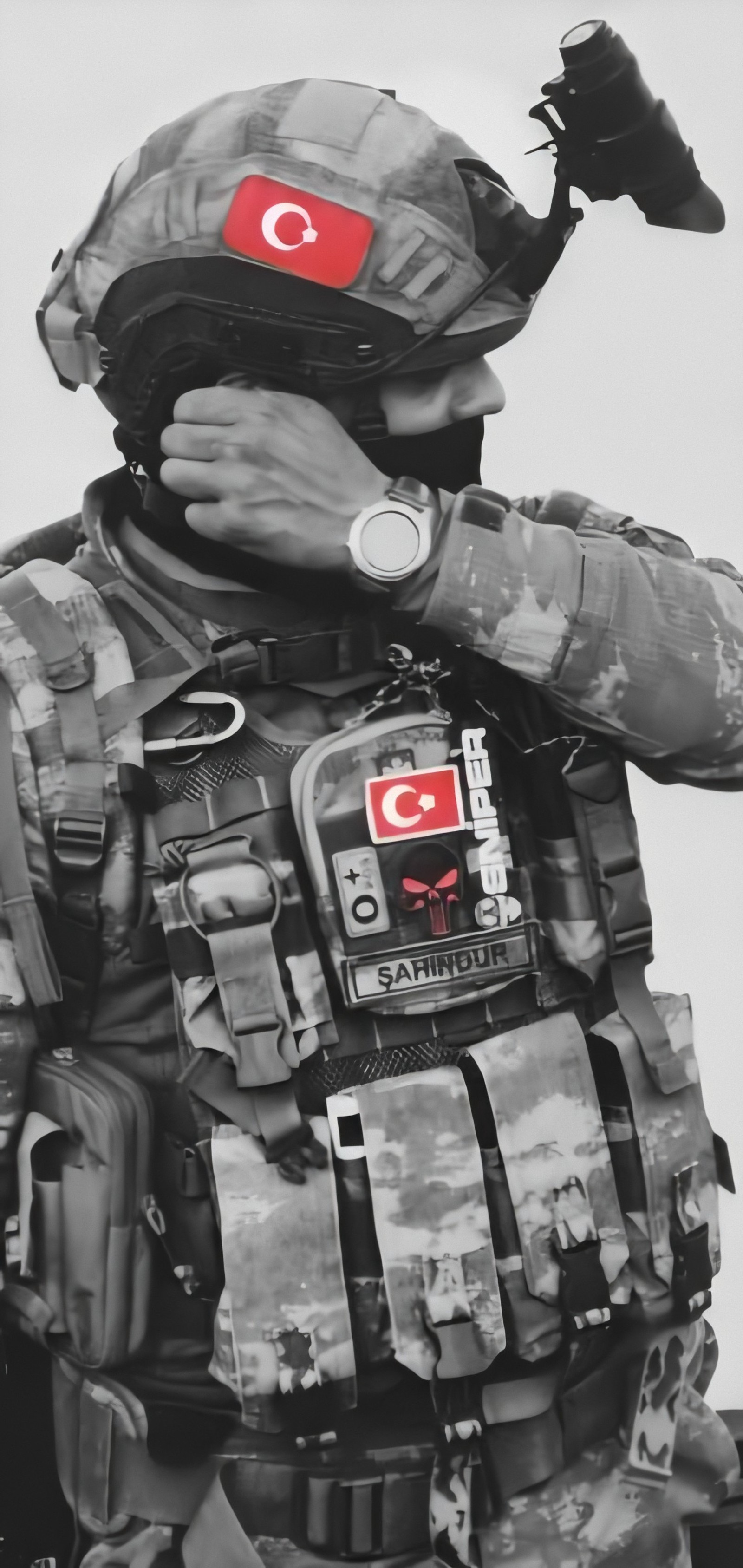 A close up of a soldier in camouflage holding a camera (army, asker, military, sniper, soldier)