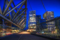 Illuminated Skyline at Dusk: A Modern Urban Landscape with Skyscrapers and Infrastructure