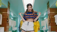 Lia from ITZY showcasing vibrant energy in a colorful MV screenshot.