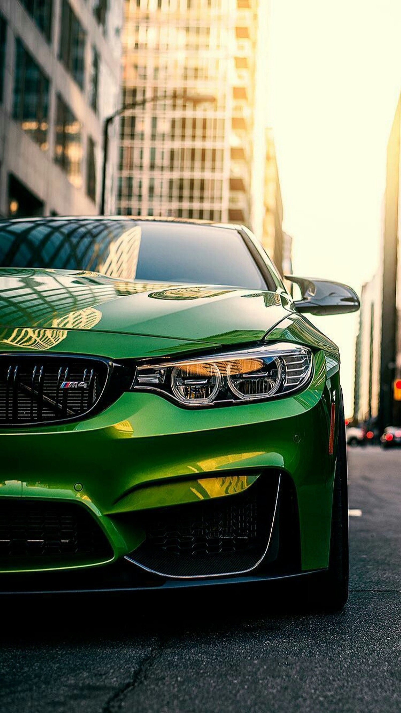 A close up of a green bmw car parked on a city street (bmw, car, coupe, f82, m power)