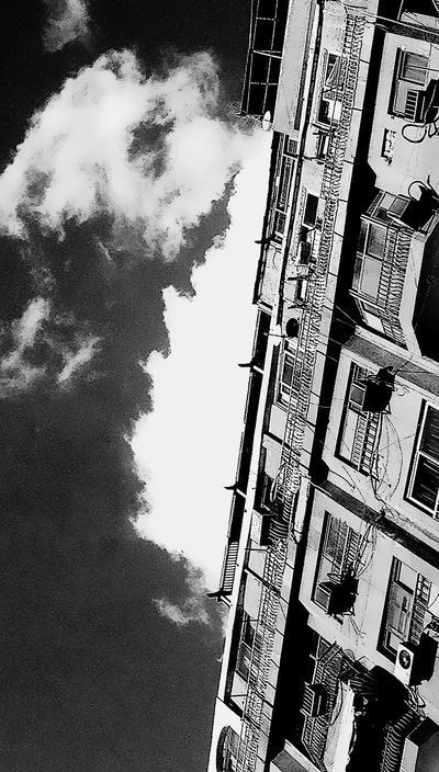 Vintage Black and White Building Against a Dramatic Sky