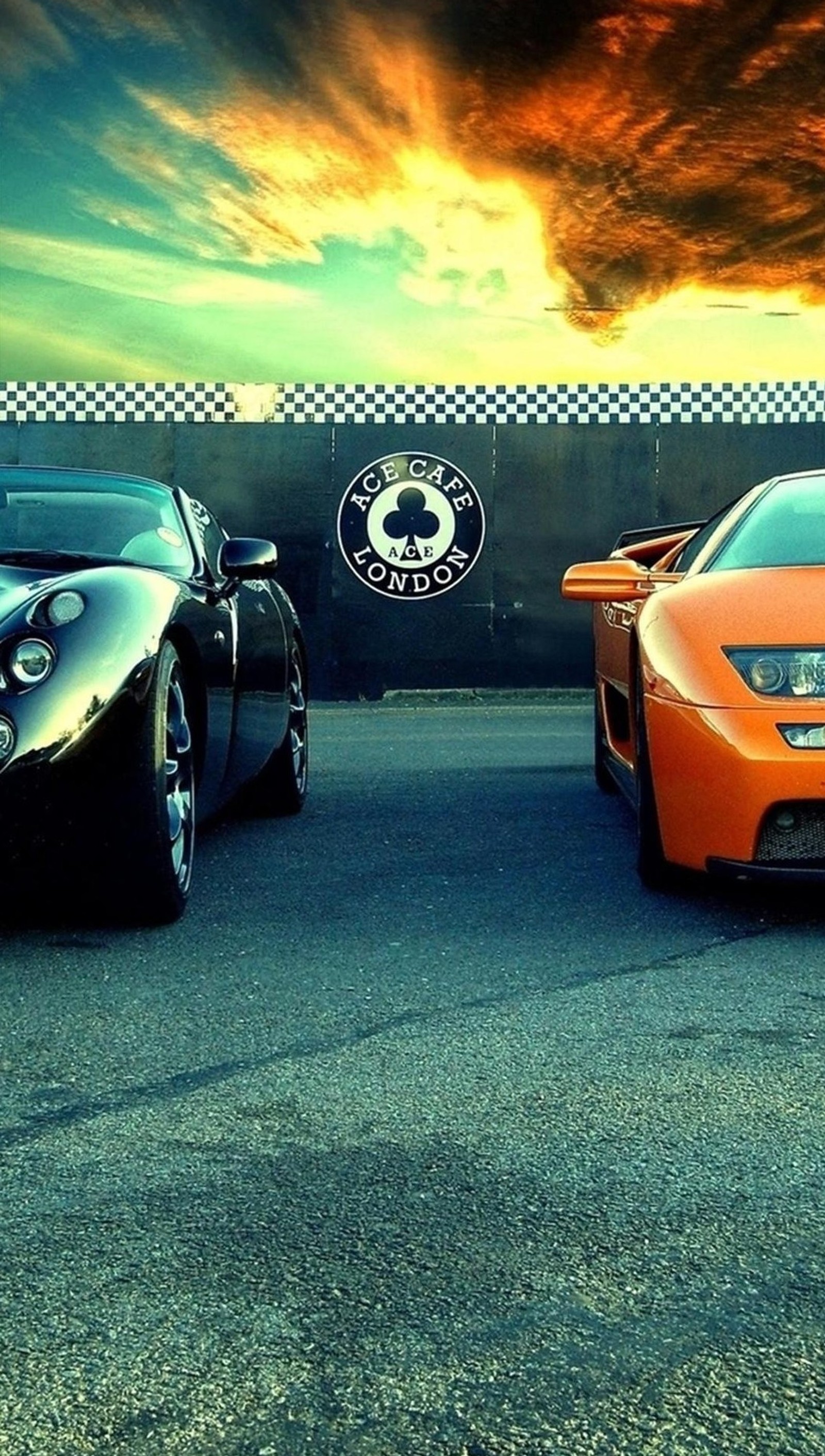 Two cars parked in a parking lot with a sunset in the background (cars, lamborghini, sport car)